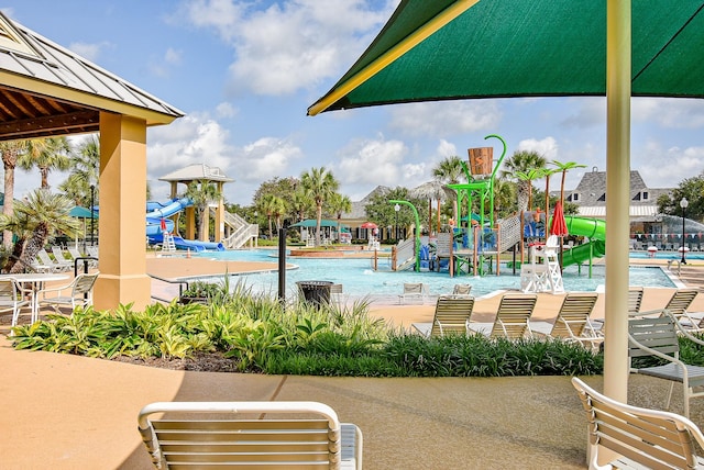 9610 Oakland Lake Way, Missouri City, TX 77459 - community pool with a water slide and a water play area