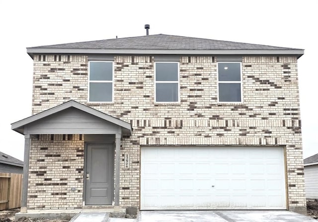 10824 Red Orchid Dr, Houston, TX 77016 - view of front of house with concrete driveway, brick siding, and an attached garage