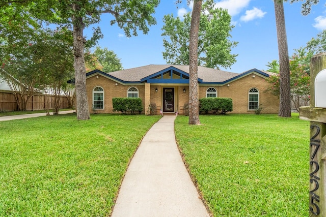 27225 Orth Ln, Conroe, TX 77385 - single story home with brick siding and a shingled roof