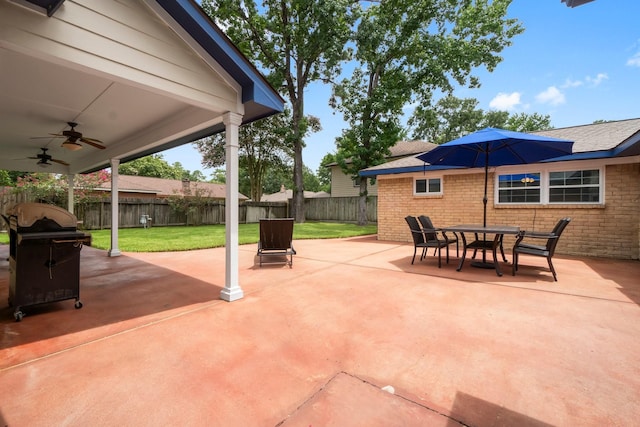 27225 Orth Ln, Conroe, TX 77385 - fenced backyard with a ceiling fan, a patio, and outdoor dining space