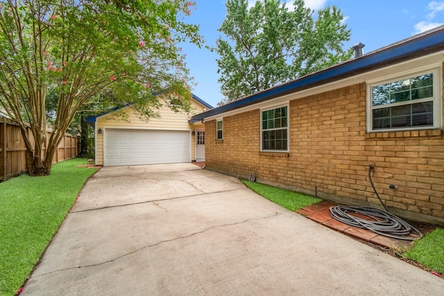 27225 Orth Ln, Conroe, TX 77385 - view of property exterior with concrete driveway, brick siding, and an attached garage