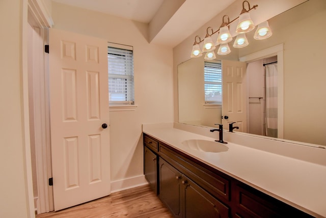 510 Daffodil St, Lake Jackson, TX 77566 - full bath with vanity, wood finished floors, and a shower with curtain