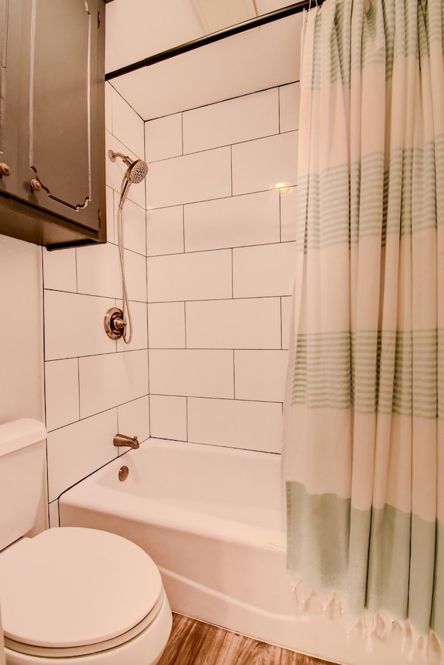 510 Daffodil St, Lake Jackson, TX 77566 - full bathroom with shower / bath combo with shower curtain and wood finished floors