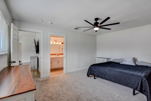 510 Daffodil St, Lake Jackson, TX 77566 - bedroom featuring carpet, ensuite bath, and a ceiling fan