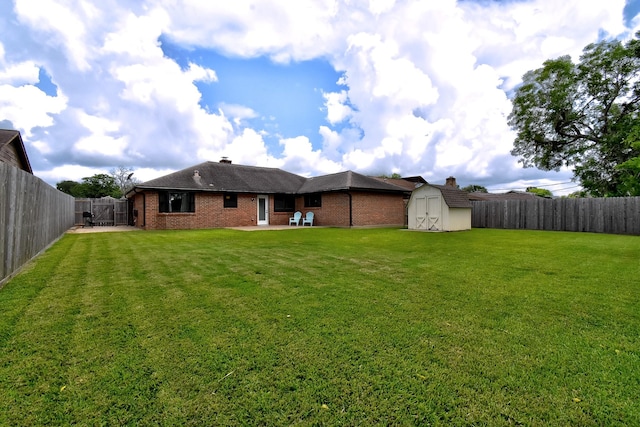 510 Daffodil St, Lake Jackson, TX 77566 - rear view of property featuring a patio area, a storage unit, a fenced backyard, and brick siding
