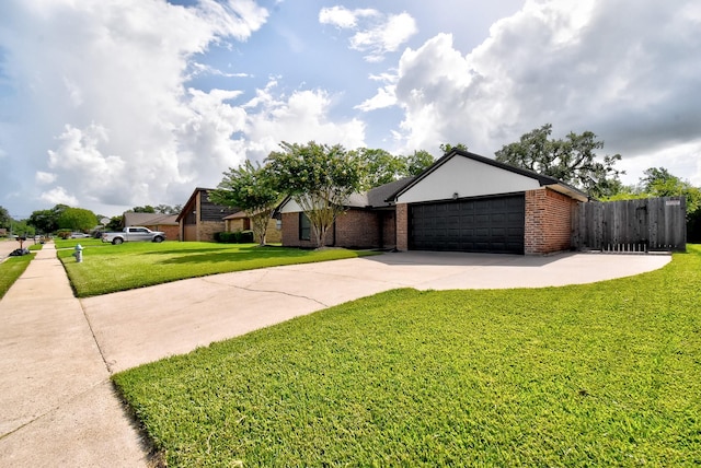510 Daffodil St, Lake Jackson, TX 77566 - view of front facade featuring concrete driveway, brick siding, and an attached garage