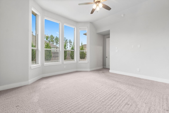 15139 Botanical Garden Dr, Conroe, TX 77302 - carpeted spare room with a ceiling fan and baseboards