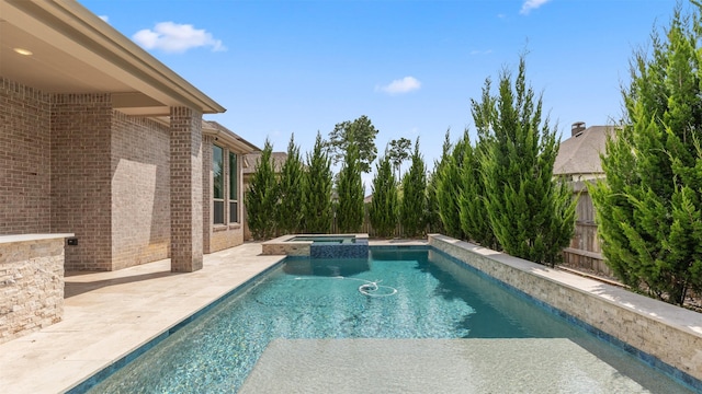 15139 Botanical Garden Dr, Conroe, TX 77302 - view of swimming pool featuring a patio area and a pool with connected hot tub