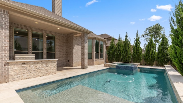 15139 Botanical Garden Dr, Conroe, TX 77302 - view of pool with area for grilling, a pool with connected hot tub, and a patio