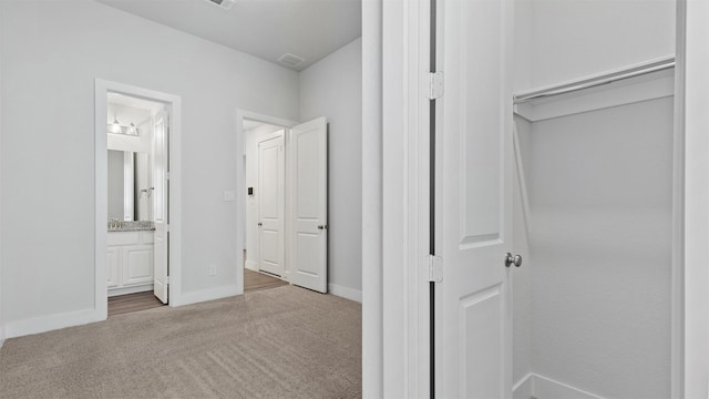 15139 Botanical Garden Dr, Conroe, TX 77302 - hallway featuring carpet floors and baseboards