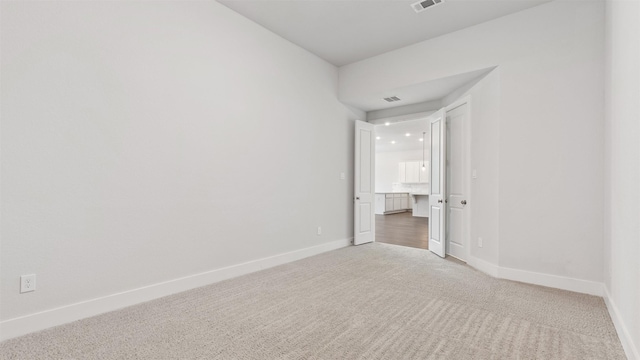 15139 Botanical Garden Dr, Conroe, TX 77302 - carpeted spare room featuring baseboards