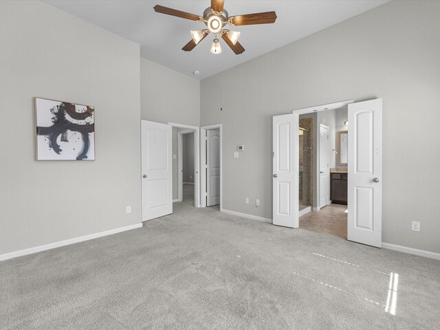 9618 Cambridge Manor Ln, Houston, TX 77045 - unfurnished bedroom with high vaulted ceiling, carpet flooring, ensuite bath, and a ceiling fan