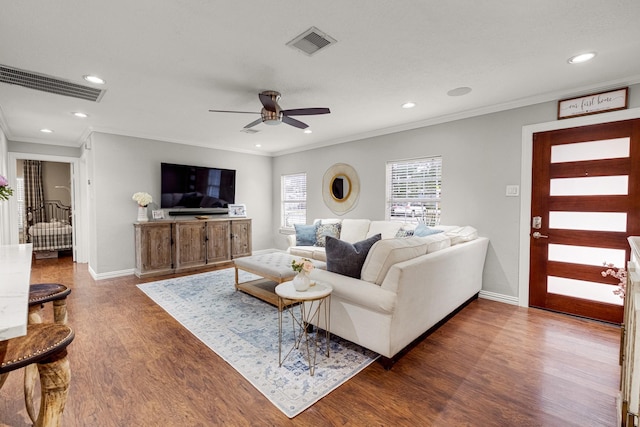 1838 Saxon Dr, Houston, TX 77018 - living room featuring ornamental molding, wood finished floors, ceiling fan, and recessed lighting