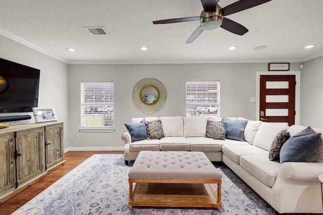 1838 Saxon Dr, Houston, TX 77018 - living room featuring healthy amount of natural light, wood finished floors, ceiling fan, crown molding, and recessed lighting