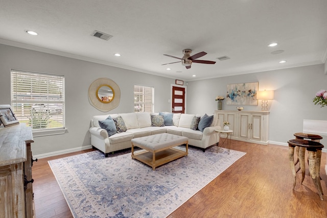 1838 Saxon Dr, Houston, TX 77018 - living area with crown molding, recessed lighting, a ceiling fan, and light wood-style floors
