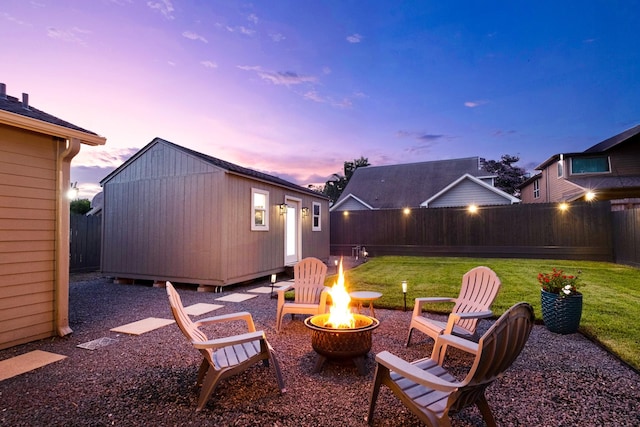 1838 Saxon Dr, Houston, TX 77018 - fenced backyard featuring an outdoor fire pit and an outbuilding