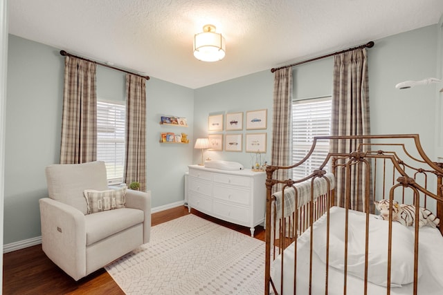 1838 Saxon Dr, Houston, TX 77018 - bedroom featuring wood finished floors and a textured ceiling