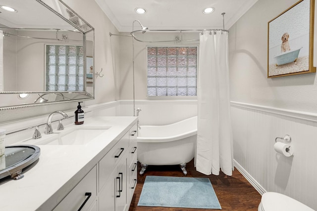 1838 Saxon Dr, Houston, TX 77018 - bathroom featuring a soaking tub, wainscoting, wood finished floors, vanity, and recessed lighting