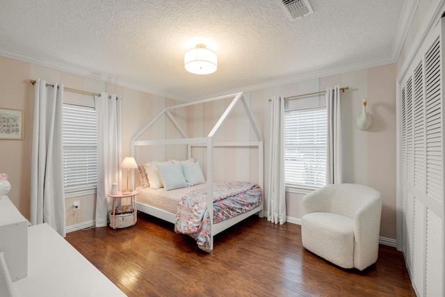 1838 Saxon Dr, Houston, TX 77018 - bedroom featuring ornamental molding, wood finished floors, and a textured ceiling