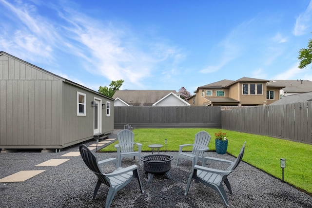 1838 Saxon Dr, Houston, TX 77018 - fenced backyard with an outdoor fire pit, an outbuilding, and a residential view