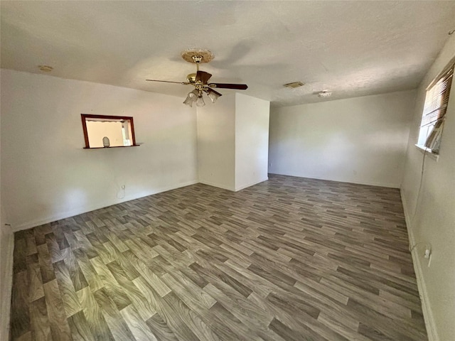 7947 Moore Dr, Pearland, TX 77584 - empty room featuring wood finished floors and a ceiling fan
