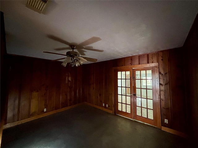 7947 Moore Dr, Pearland, TX 77584 - unfurnished room featuring wooden walls, ceiling fan, and french doors
