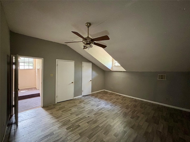 7947 Moore Dr, Pearland, TX 77584 - additional living space featuring lofted ceiling, a skylight, wood finished floors, and a ceiling fan