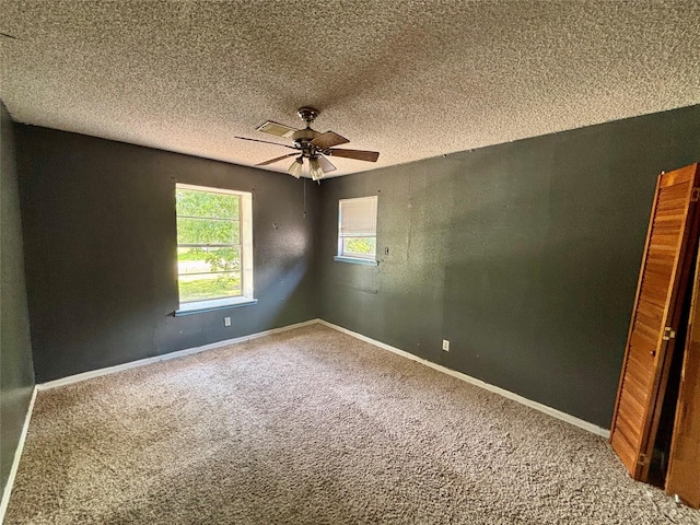 7947 Moore Dr, Pearland, TX 77584 - carpeted spare room with ceiling fan and a textured ceiling