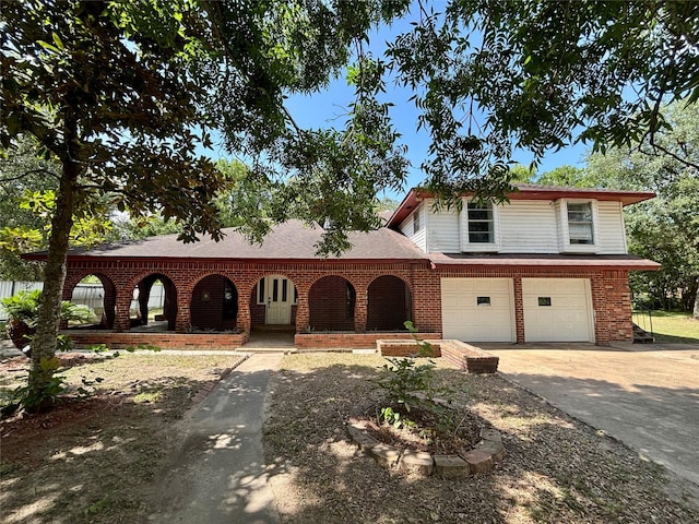 7947 Moore Dr, Pearland, TX 77584 - view of front of house featuring driveway, brick siding, an attached garage, a porch, and roof with shingles