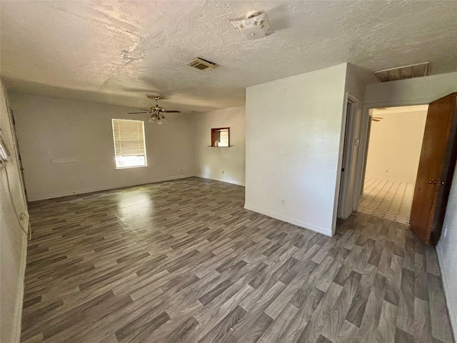 7947 Moore Dr, Pearland, TX 77584 - empty room with wood finished floors, a textured ceiling, and ceiling fan