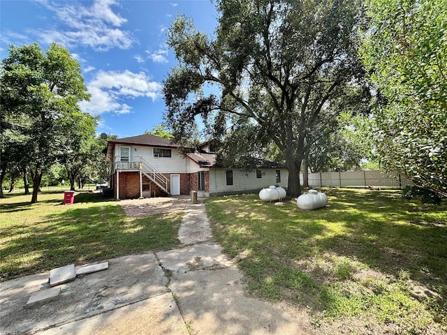 7947 Moore Dr, Pearland, TX 77584 - rear view of property with stairway and brick siding