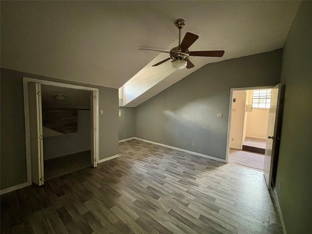 7947 Moore Dr, Pearland, TX 77584 - bonus room with wood finished floors, a ceiling fan, and lofted ceiling