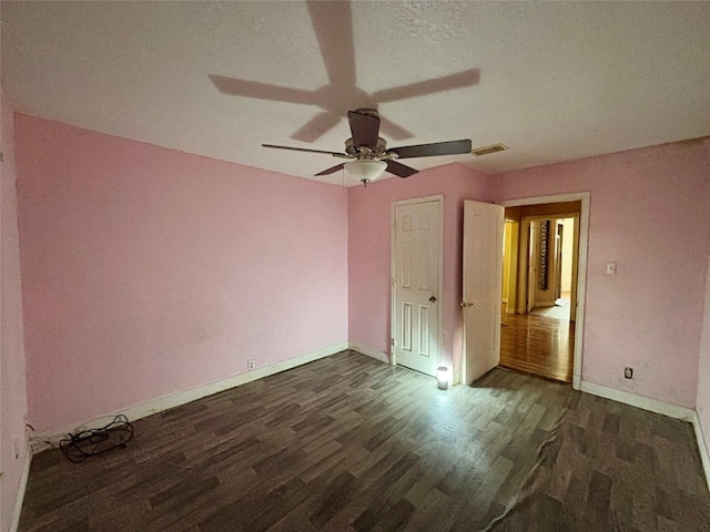 7947 Moore Dr, Pearland, TX 77584 - unfurnished bedroom with dark wood-style floors and ceiling fan
