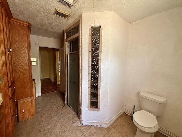 7947 Moore Dr, Pearland, TX 77584 - bathroom with a textured ceiling and tile patterned floors