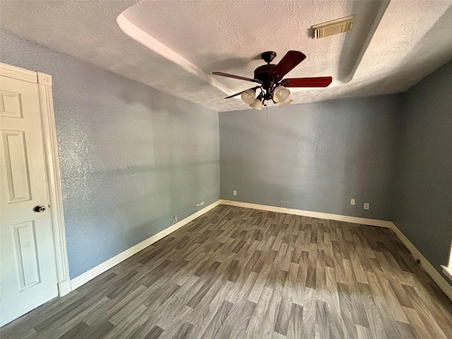 7947 Moore Dr, Pearland, TX 77584 - unfurnished room with a textured ceiling, wood finished floors, and a ceiling fan