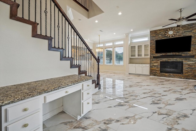 13205 Dartmoor Terrace Dr, Houston, TX 77077 - staircase with ornamental molding, built in study area, marble tiled flooring, a ceiling fan, and recessed lighting