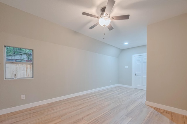 6170 Beech Dr, Montgomery, TX 77316 - empty room featuring light wood-style floors, a ceiling fan, vaulted ceiling, and recessed lighting