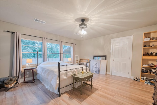 6170 Beech Dr, Montgomery, TX 77316 - bedroom featuring light wood finished floors and baseboards