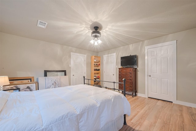 6170 Beech Dr, Montgomery, TX 77316 - bedroom with light wood finished floors and baseboards