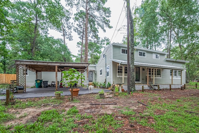 6170 Beech Dr, Montgomery, TX 77316 - rear view of house with a detached carport