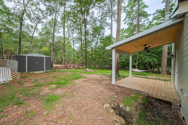 6170 Beech Dr, Montgomery, TX 77316 - view of yard with a deck and a storage unit