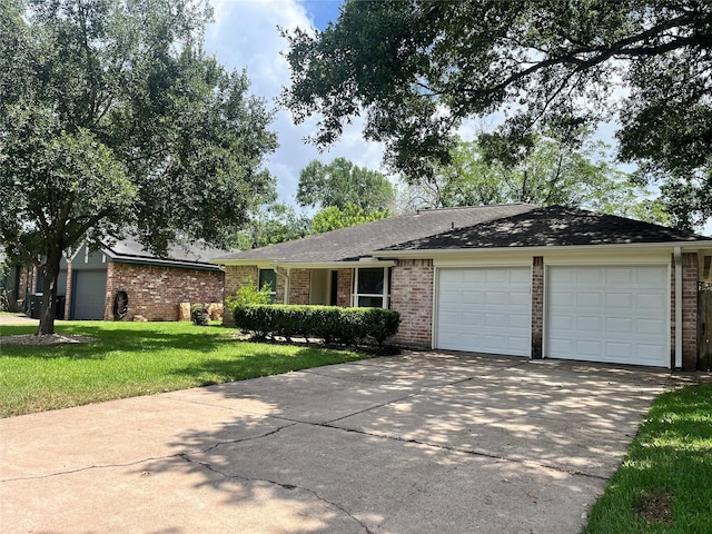 1502 Chilton Ln, Katy, TX 77493 - ranch-style home with brick siding, an attached garage, and concrete driveway
