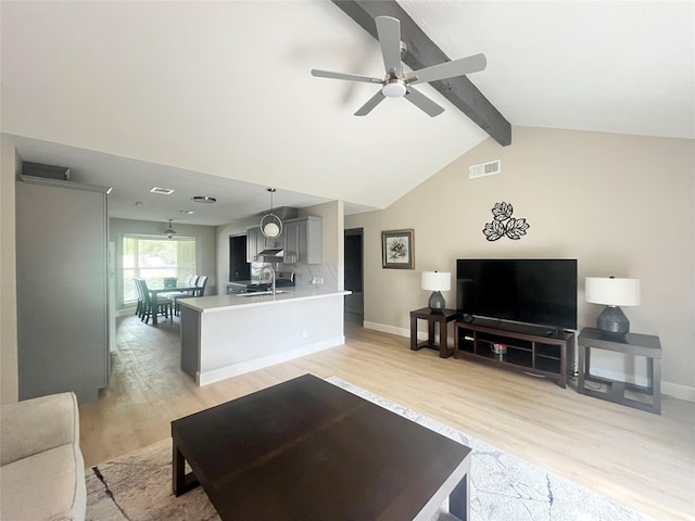 1502 Chilton Ln, Katy, TX 77493 - living room with light wood finished floors and ceiling fan