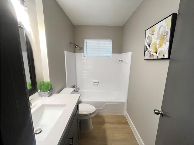 1502 Chilton Ln, Katy, TX 77493 - bathroom with vanity, wood finished floors, and tub / shower combination