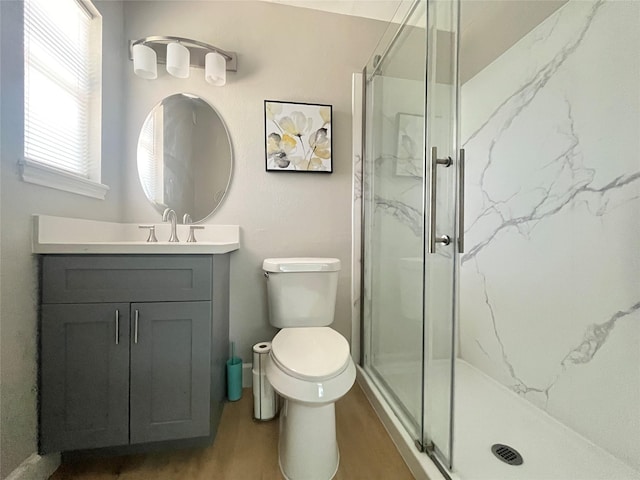 1502 Chilton Ln, Katy, TX 77493 - full bath featuring a marble finish shower, vanity, and wood finished floors