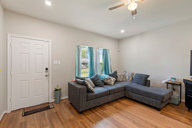 7921 Sparta St, Houston, TX 77028 - living area with light wood finished floors, ceiling fan, and recessed lighting