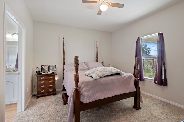 7921 Sparta St, Houston, TX 77028 - bedroom featuring light carpet, ensuite bath, and ceiling fan