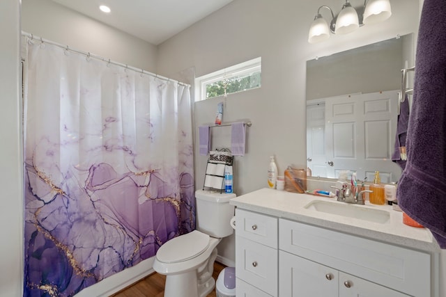 7921 Sparta St, Houston, TX 77028 - bathroom featuring vanity, wood finished floors, and curtained shower