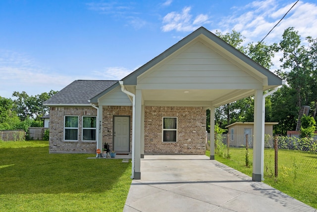 7921 Sparta St, Houston, TX 77028 - view of front of property with concrete driveway, an attached carport, and brick siding