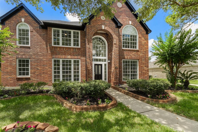 7147 Hot Creek Trce, Humble, TX 77346 - view of front of property with brick siding and a front yard